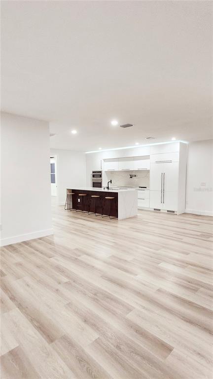 7609 Deedra Circle Port Richey, FL 34668 - Photo 18 of 63 a view of kitchen and empty room