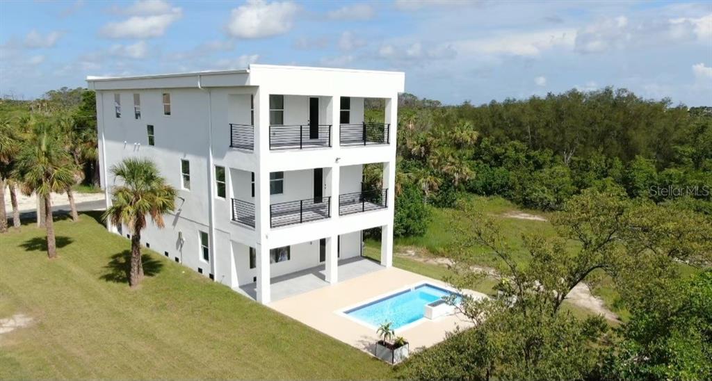 7609 Deedra Circle Port Richey, FL 34668 - Photo 2 of 63 a view of residential houses with yard and trees