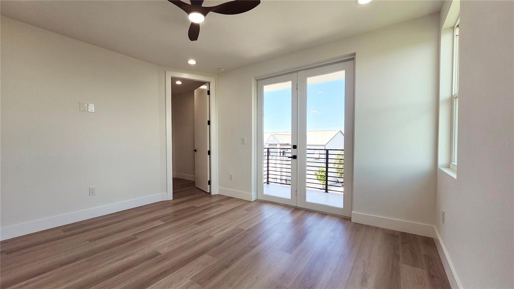 7609 Deedra Circle Port Richey, FL 34668 - Photo 29 of 63 wooden floor in an empty room with a window