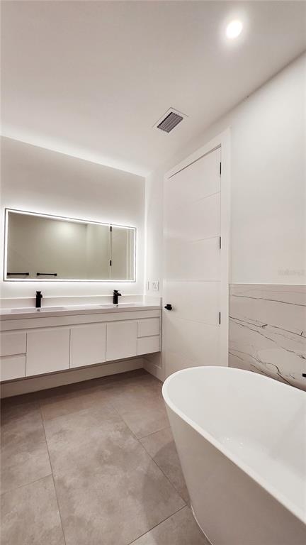 7609 Deedra Circle Port Richey, FL 34668 - Photo 35 of 63 a bathroom with a bathtub and a sink