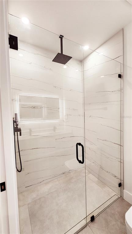 7609 Deedra Circle Port Richey, FL 34668 - Photo 37 of 63 a bathroom with a shower