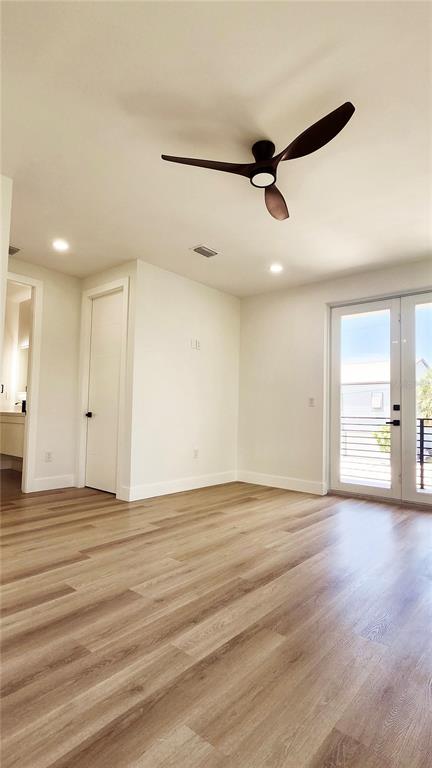 7609 Deedra Circle Port Richey, FL 34668 - Photo 48 of 63 an empty room with wooden floor and windows