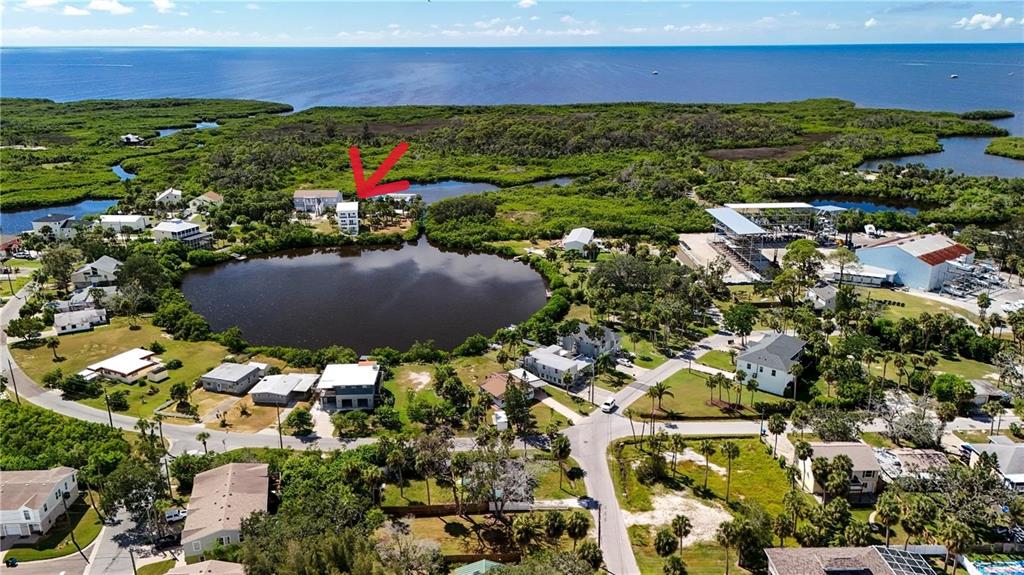 7609 Deedra Circle Port Richey, FL 34668 - Photo 5 of 63 a view of a house with a yard and lake view