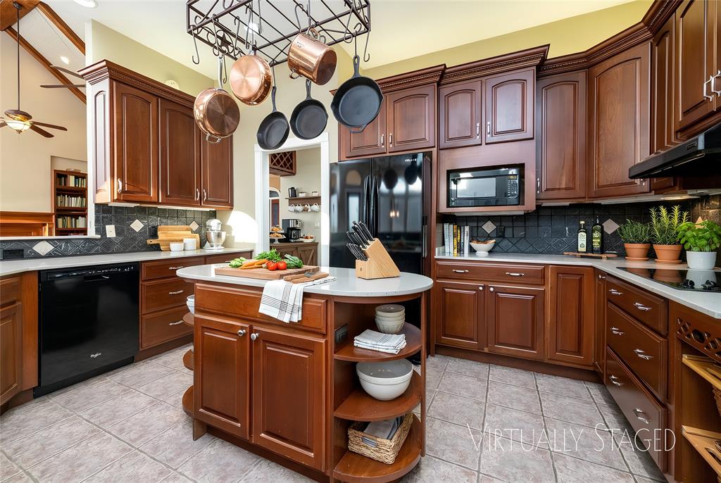270 Stone Mountain Road Cresson, TX 76035 - Photo 12 of 40 a kitchen with stainless steel appliances granite countertop a sink a stove and a microwave