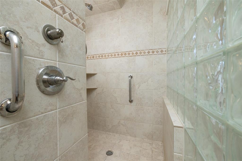 270 Stone Mountain Road Cresson, TX 76035 - Photo 19 of 40 a bathroom with a shower and a mirror