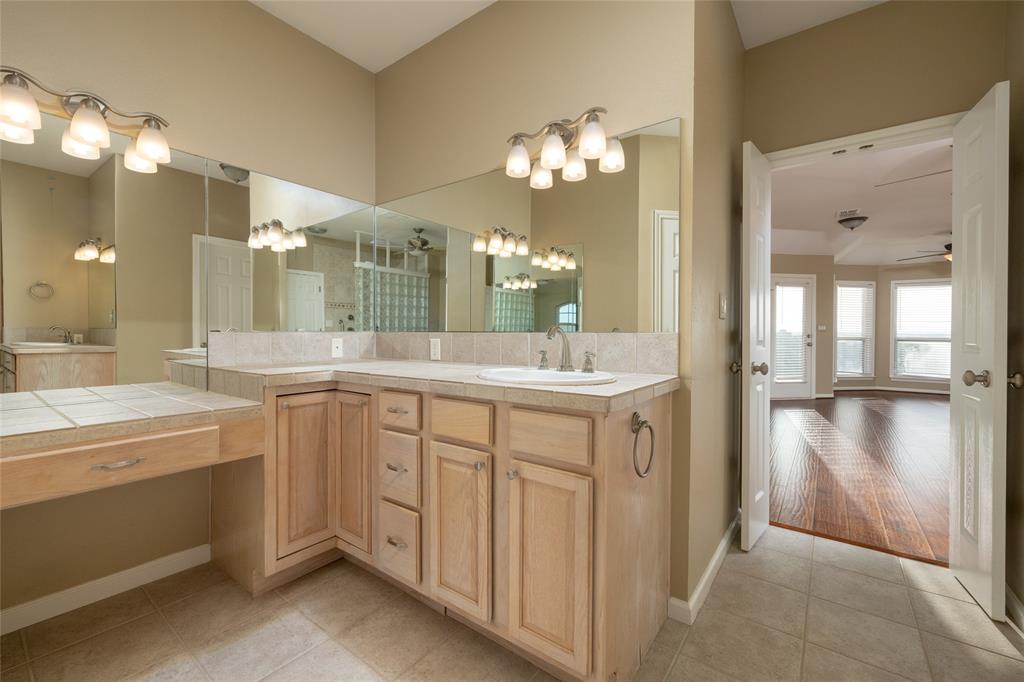 270 Stone Mountain Road Cresson, TX 76035 - Photo 21 of 40 a bathroom with a double vanity sink mirror and