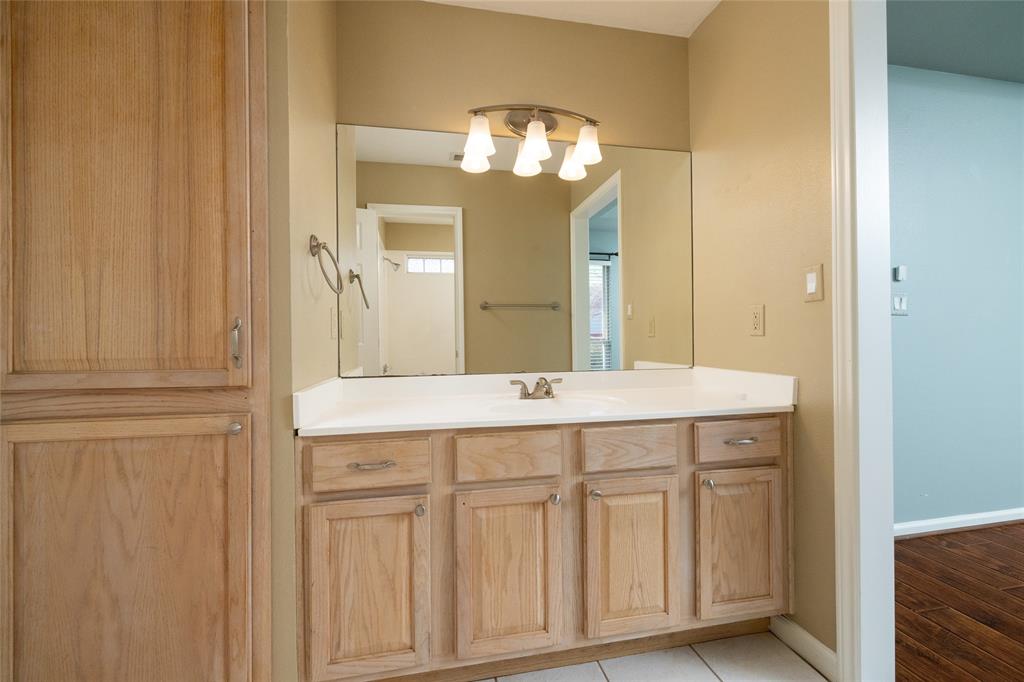 270 Stone Mountain Road Cresson, TX 76035 - Photo 23 of 40 a bathroom with a double vanity sink and a mirror