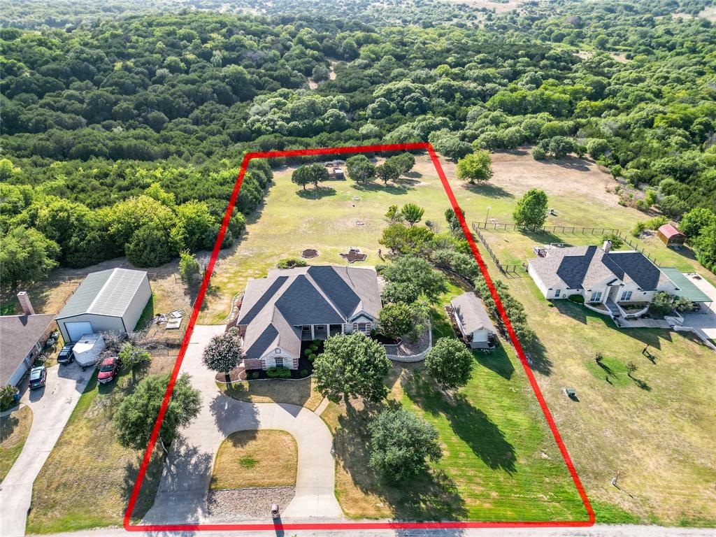 270 Stone Mountain Road Cresson, TX 76035 - Photo 37 of 40 an aerial view of residential house with outdoor space and swimming pool