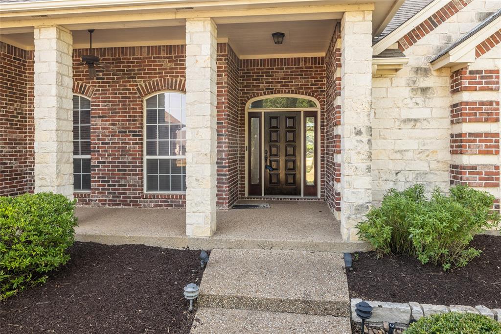 270 Stone Mountain Road Cresson, TX 76035 - Photo 4 of 40 a front view of a house with a yard