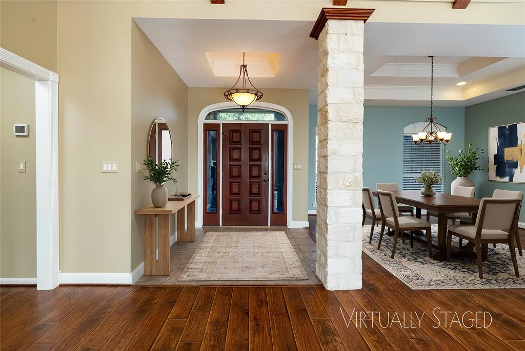 270 Stone Mountain Road Cresson, TX 76035 - Photo 6 of 40 a view of a dining room with furniture and wooden floor