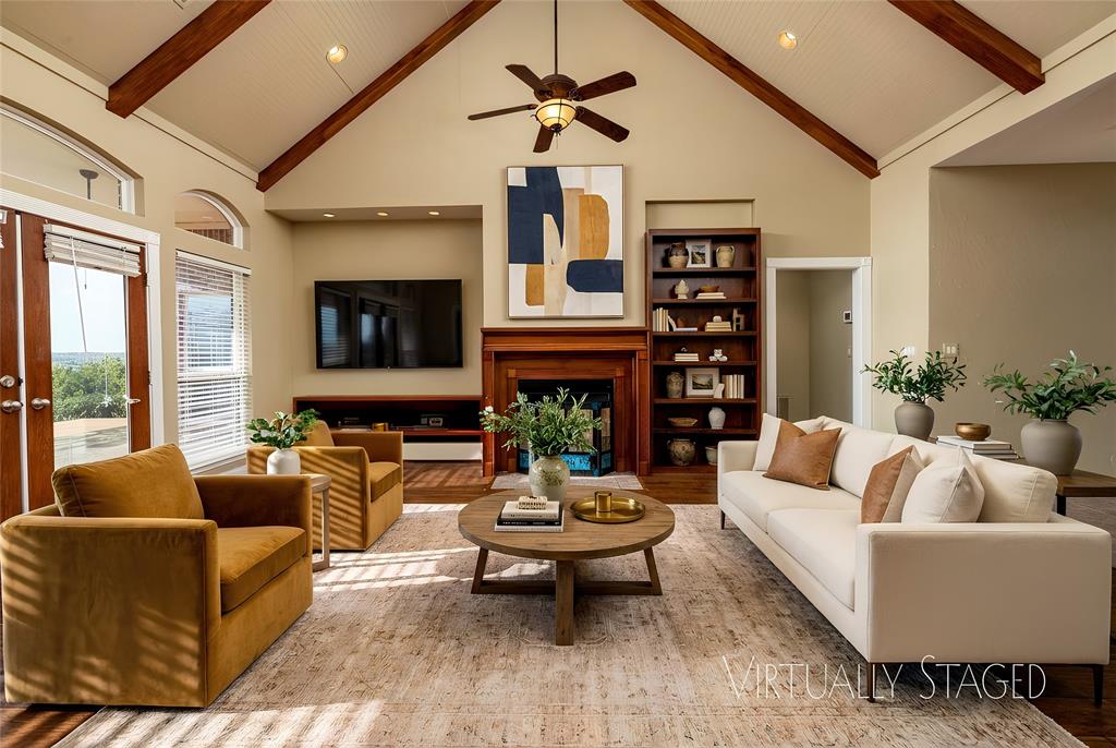 270 Stone Mountain Road Cresson, TX 76035 - Photo 9 of 40 a living room with fireplace furniture and a large window