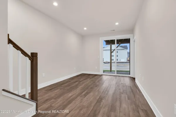 a view of wooden floor in an empty room