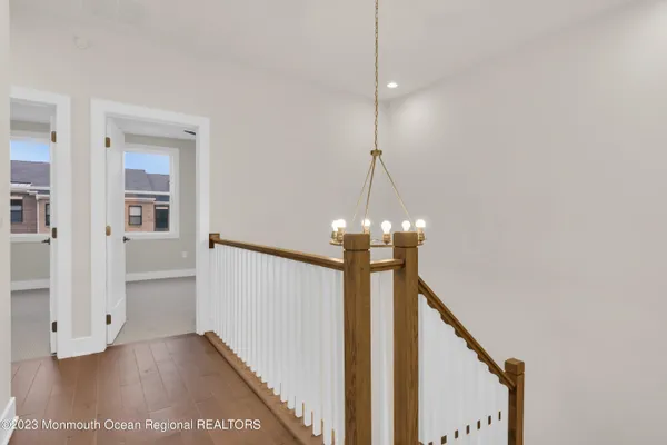 a view of a hallway with a chandelier