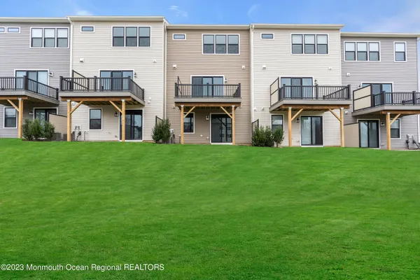 a view of front of house with a yard