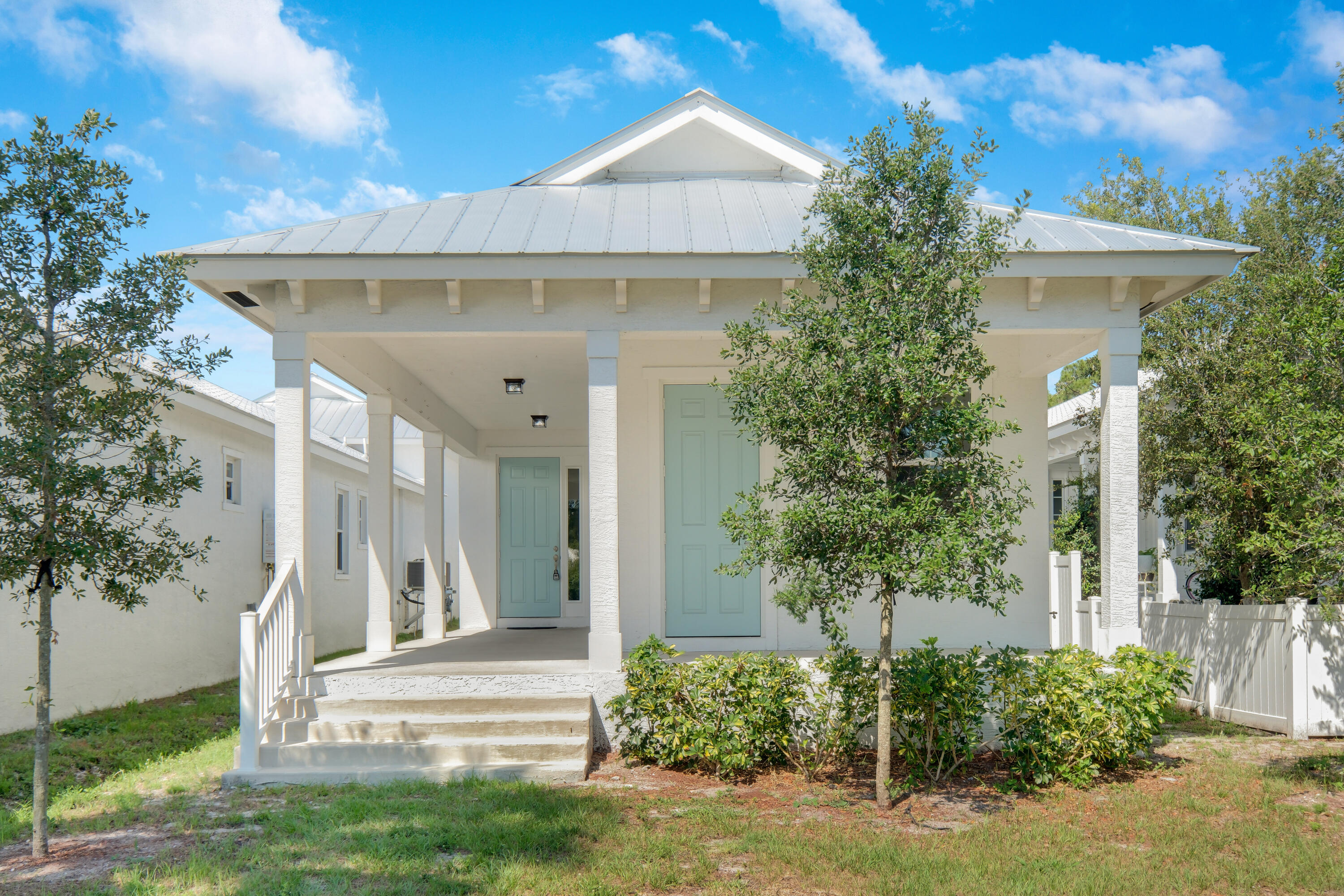 4982 Southeast Railway Avenue Stuart, FL 34997 - Photo 16 of 36 a front view of a house with a garden