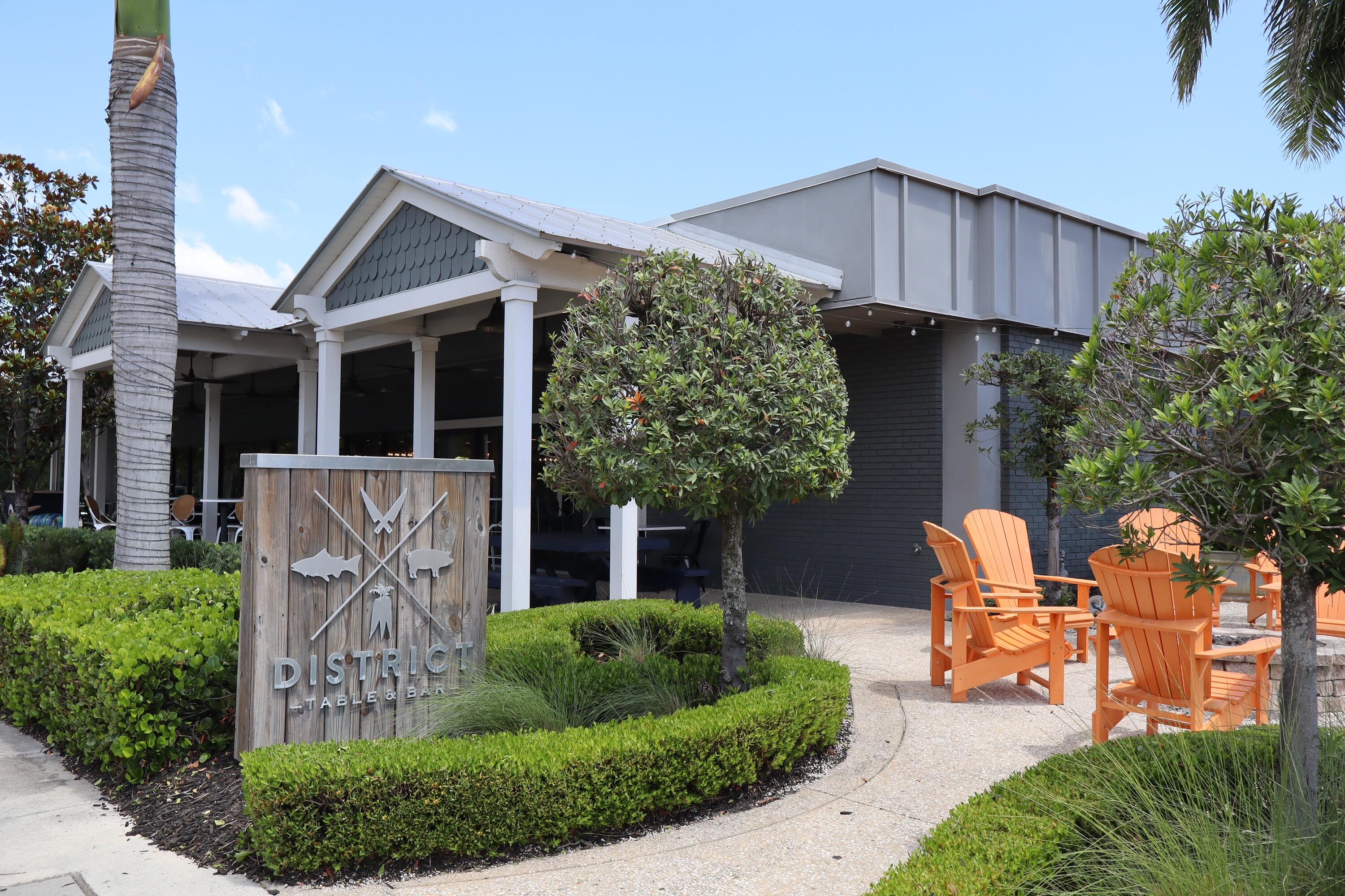 4982 Southeast Railway Avenue Stuart, FL 34997 - Photo 32 of 36 a front view of a house with garden and trees
