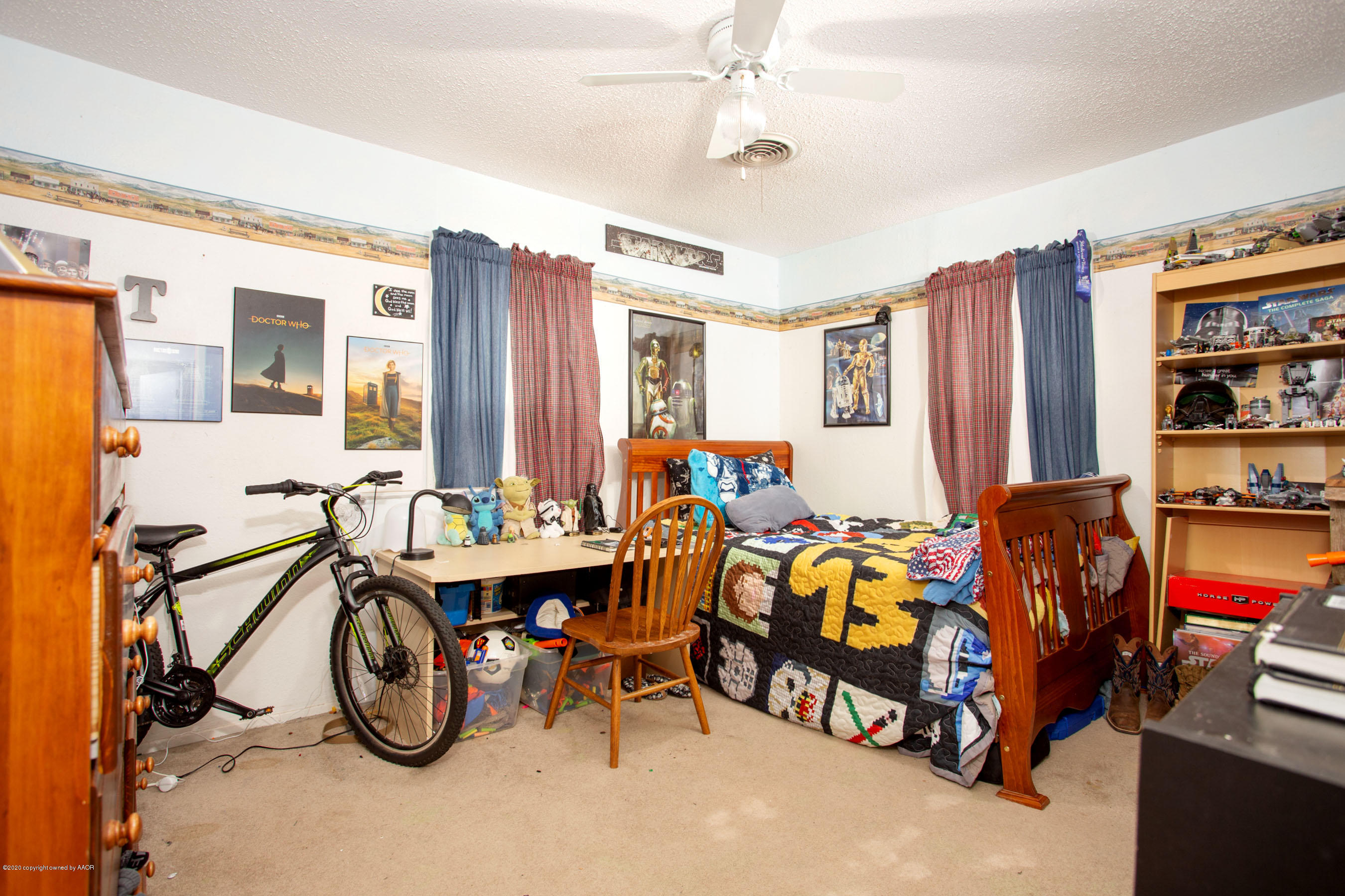 4226 South Harrison Street Amarillo, TX 79110 - Photo 6 of 17 a bedroom with furniture and a large window