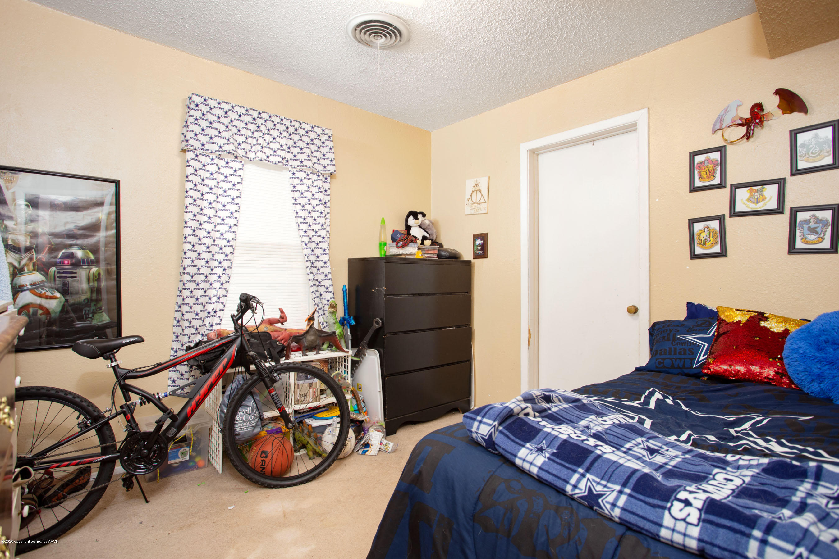 4226 South Harrison Street Amarillo, TX 79110 - Photo 7 of 17 a bedroom with furniture and a bed