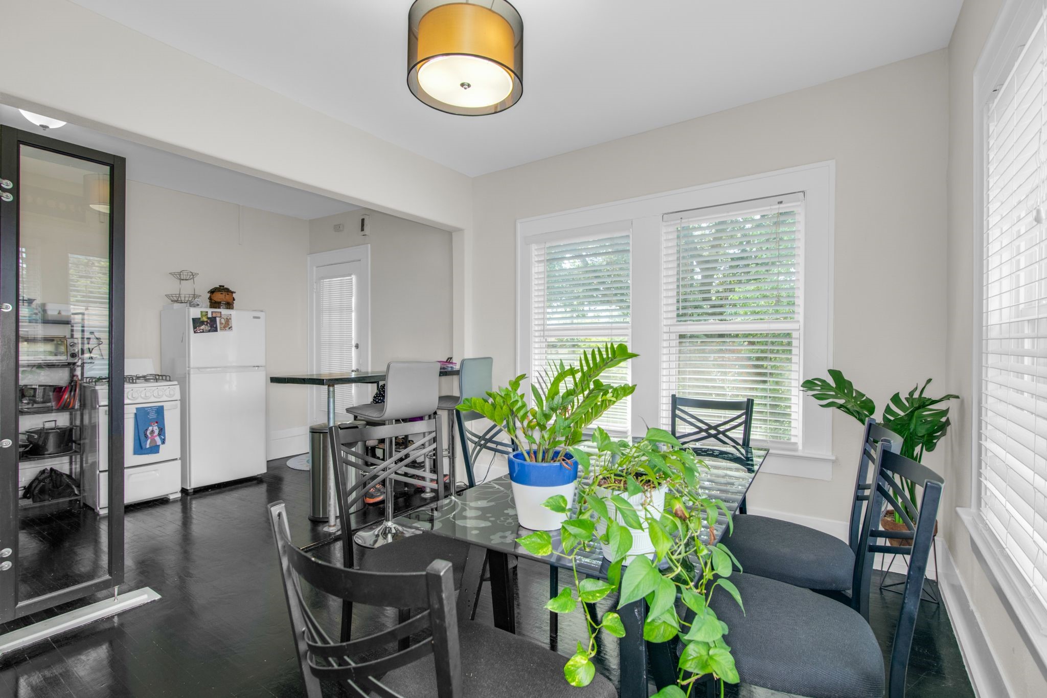 1432 Godwin Street Houston, TX 77023 - Photo 15 of 40 a view of a dining room with furniture window and wooden floor