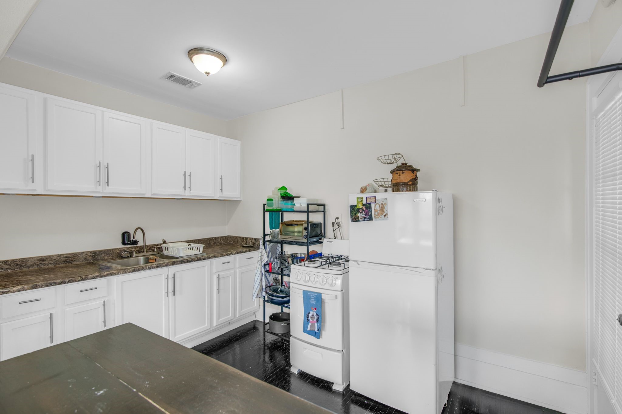 1432 Godwin Street Houston, TX 77023 - Photo 17 of 40 a white refrigerator freezer sitting in a kitchen