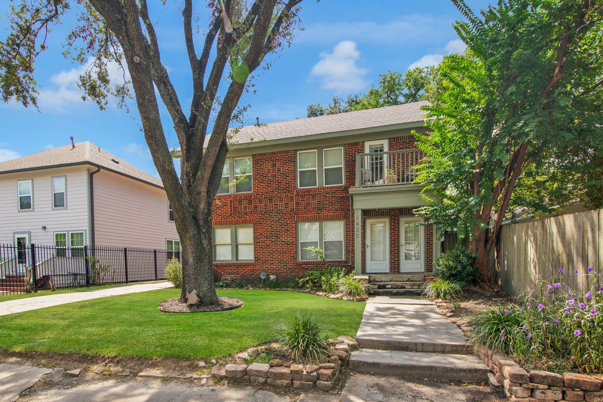 1432 Godwin Street Houston, TX 77023 - Photo 2 of 40 a front view of a house with a garden and tree