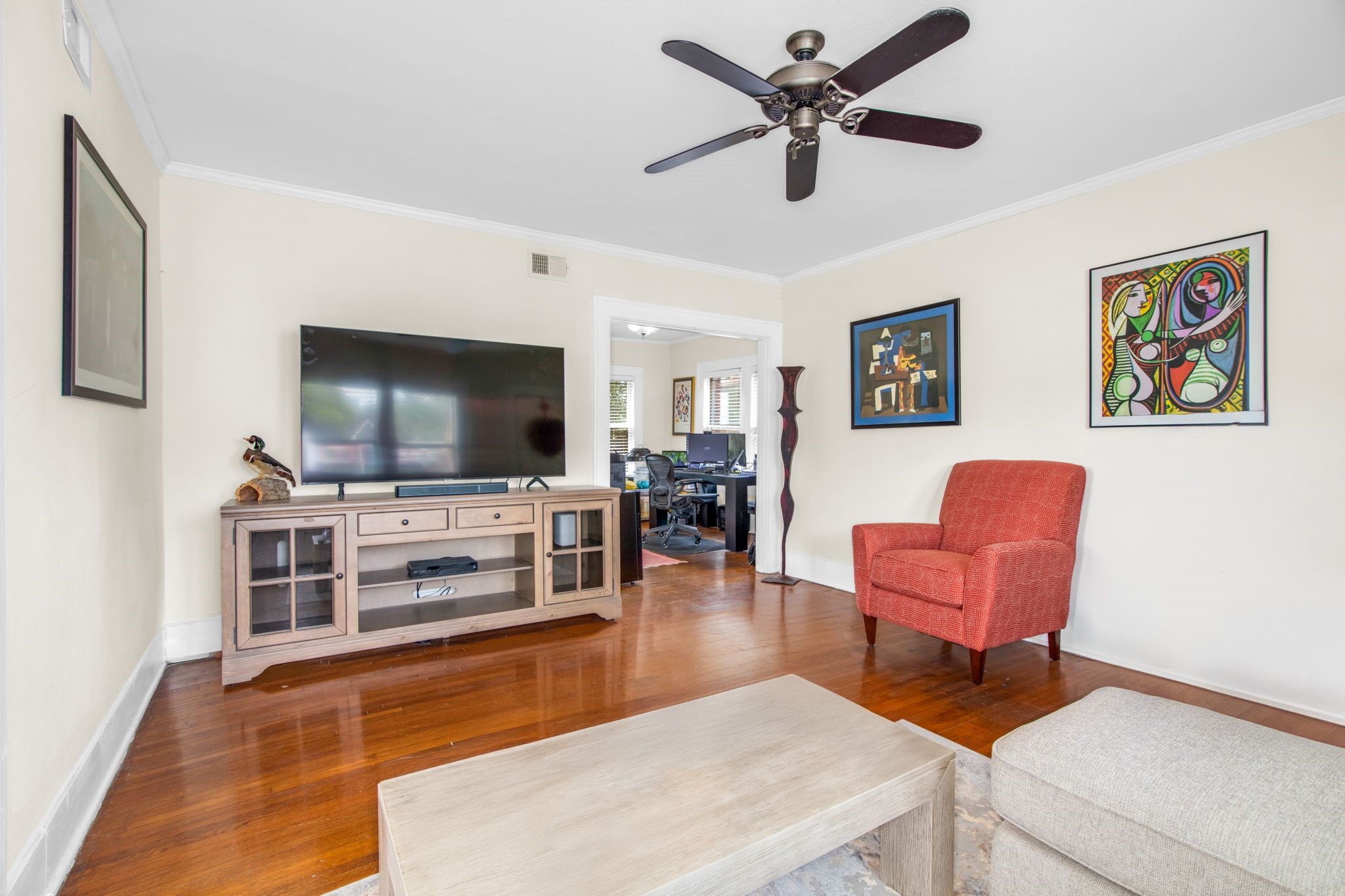 1432 Godwin Street Houston, TX 77023 - Photo 22 of 40 a living room with furniture and a flat screen tv