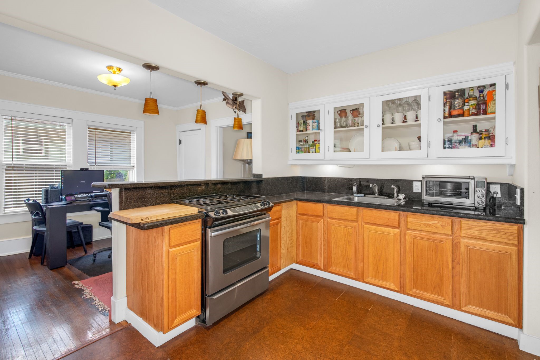 1432 Godwin Street Houston, TX 77023 - Photo 34 of 40 a kitchen with stainless steel appliances granite countertop a stove and a sink