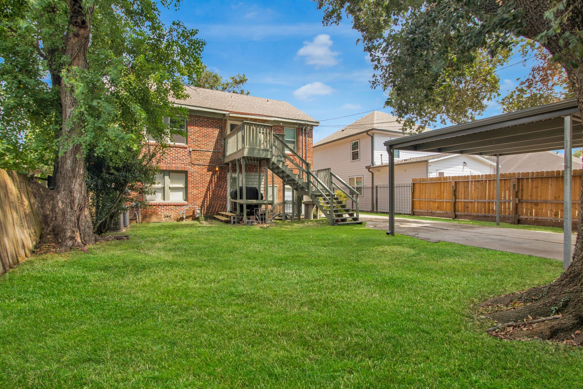 1432 Godwin Street Houston, TX 77023 - Photo 39 of 40 a view of a house with backyard and a tree