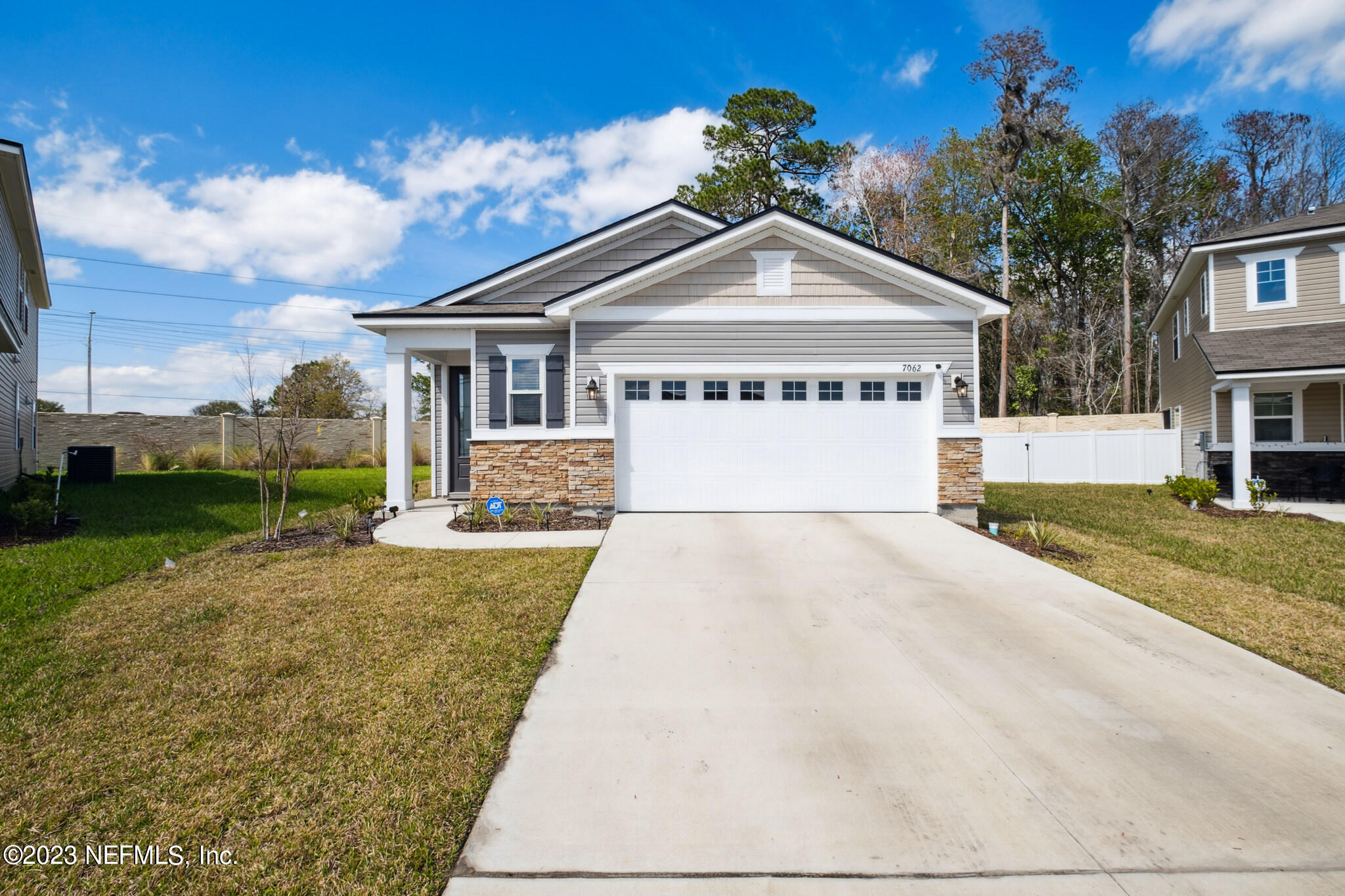 7062 Red Timber Road Jacksonville, FL 32244 - Photo 2 of 31 a front view of a house with a yard