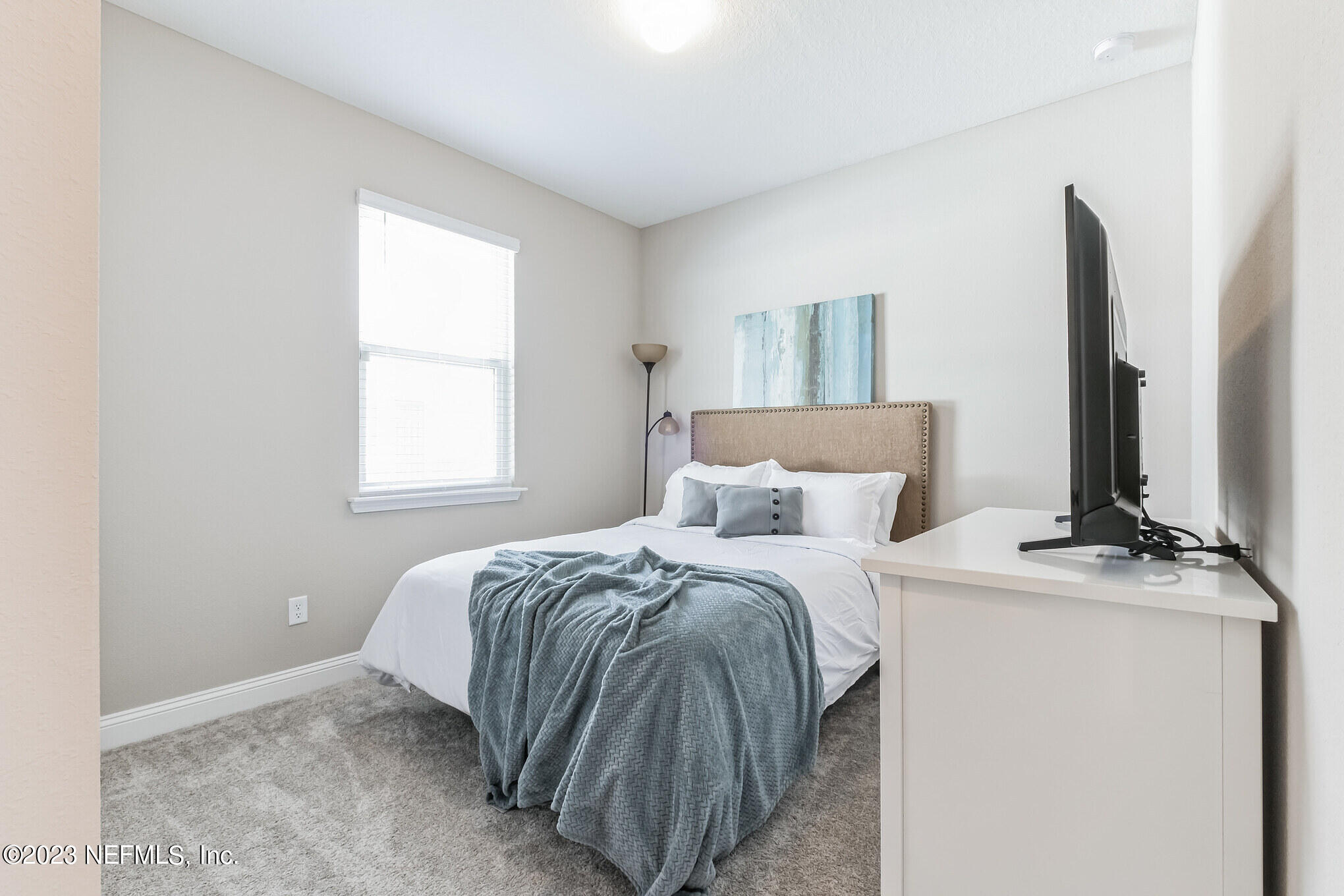 7062 Red Timber Road Jacksonville, FL 32244 - Photo 21 of 31 a bedroom with a bed and a window