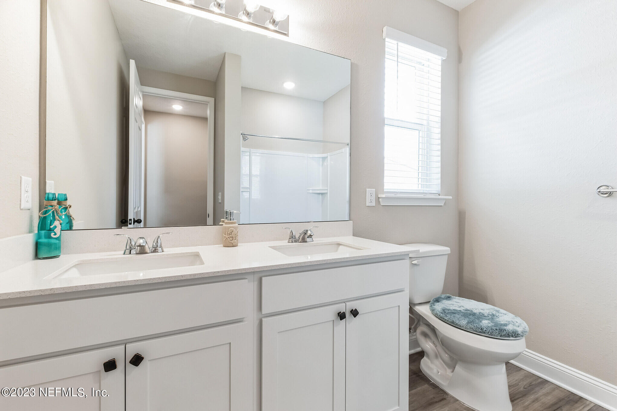 7062 Red Timber Road Jacksonville, FL 32244 - Photo 22 of 31 a bathroom with a sink and a mirror