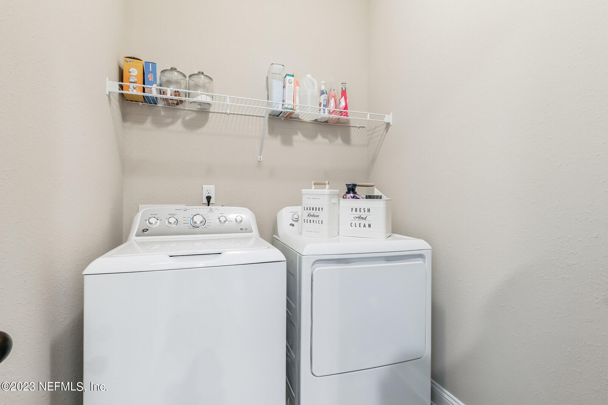 7062 Red Timber Road Jacksonville, FL 32244 - Photo 24 of 31 a utility room with dryer and washer