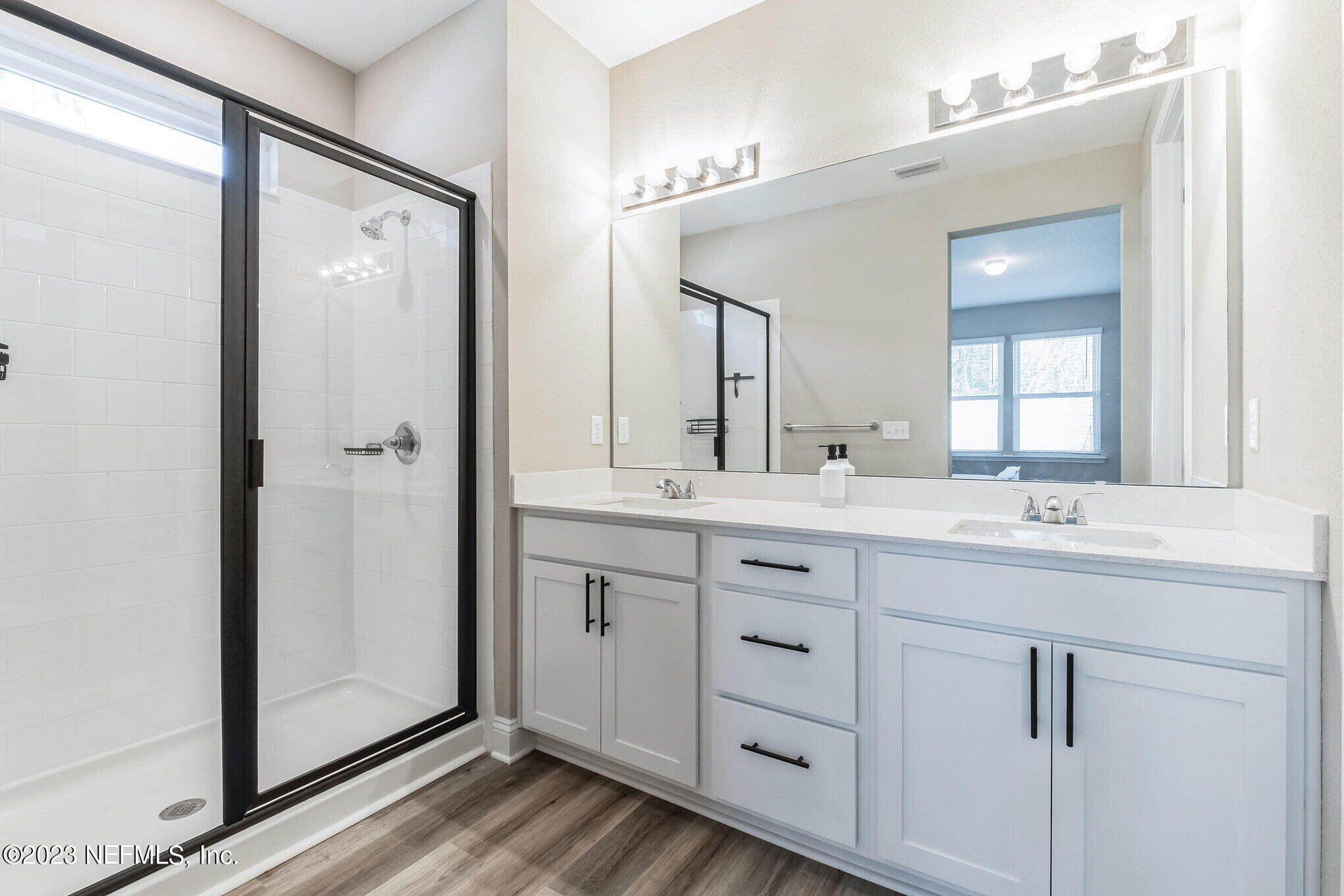 7062 Red Timber Road Jacksonville, FL 32244 - Photo 27 of 31 a bathroom with a double vanity sink mirror and shower
