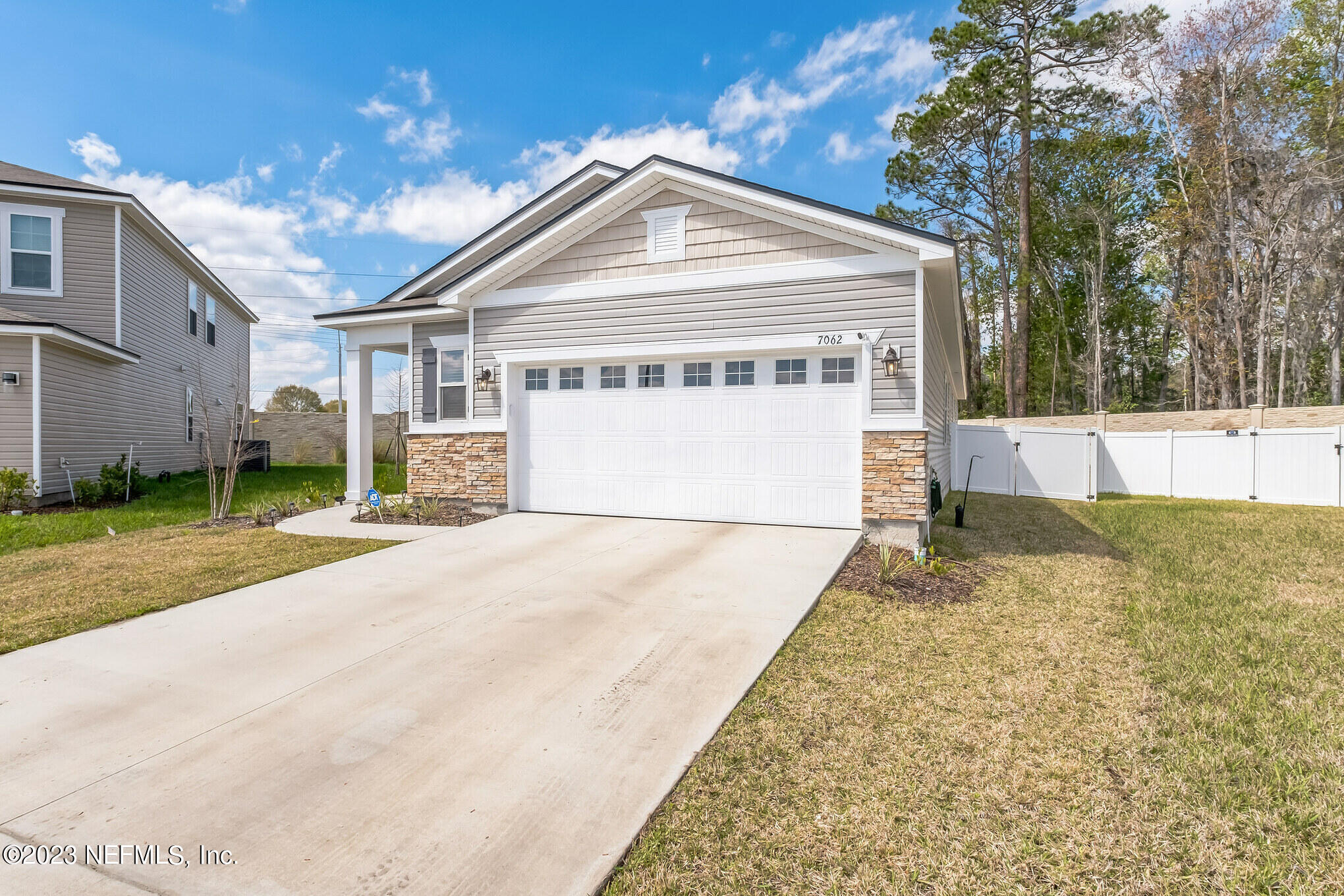 7062 Red Timber Road Jacksonville, FL 32244 - Photo 4 of 31 a front view of a house with a yard