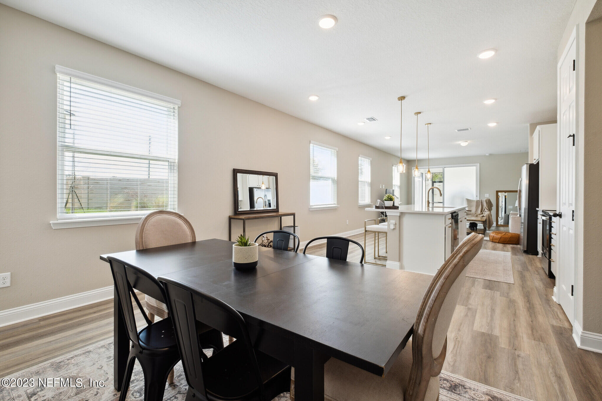 7062 Red Timber Road Jacksonville, FL 32244 - Photo 5 of 31 a view of a dining room with furniture and wooden floor