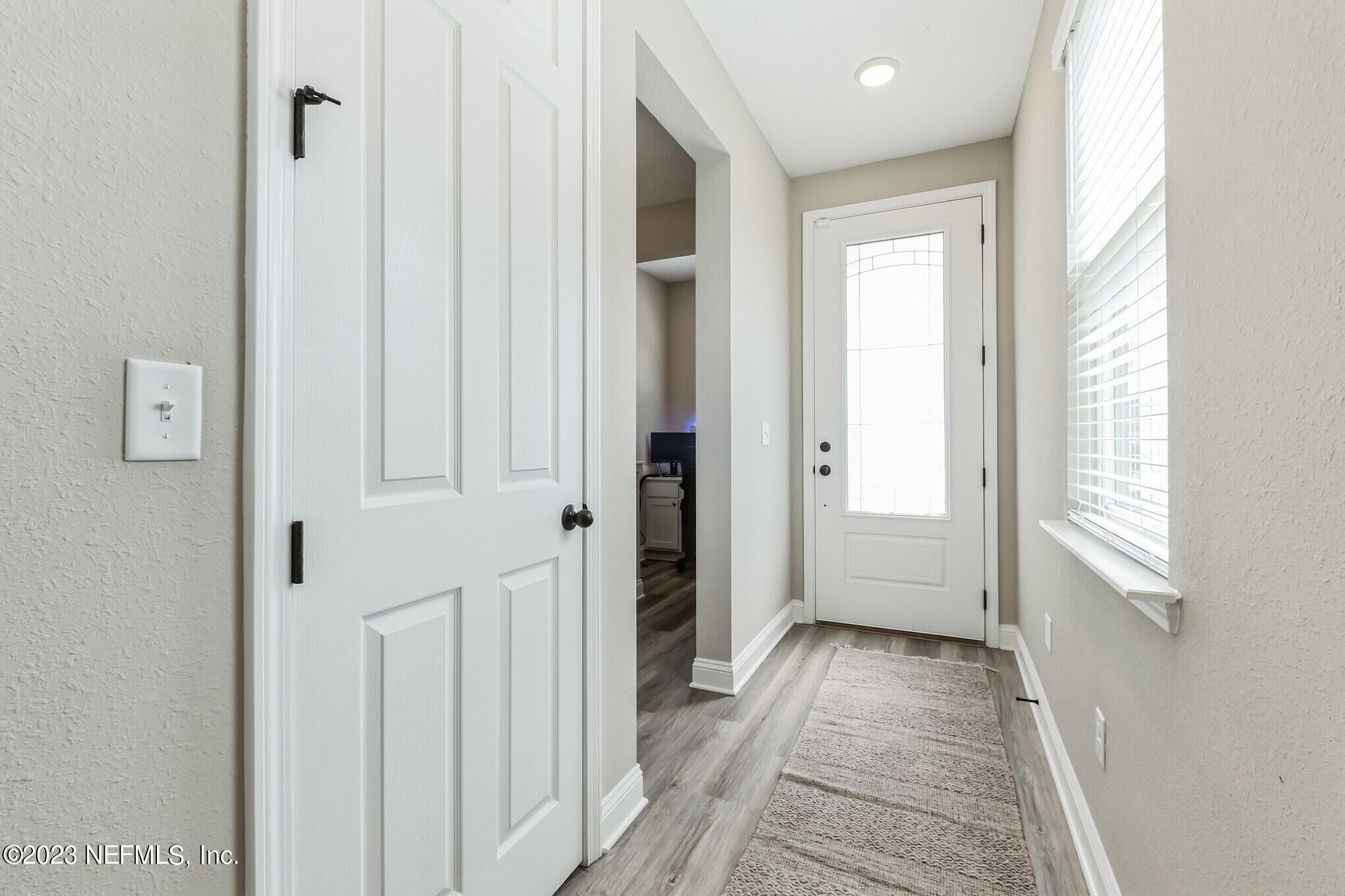 7062 Red Timber Road Jacksonville, FL 32244 - Photo 8 of 31 a view of a hallway with a white walls