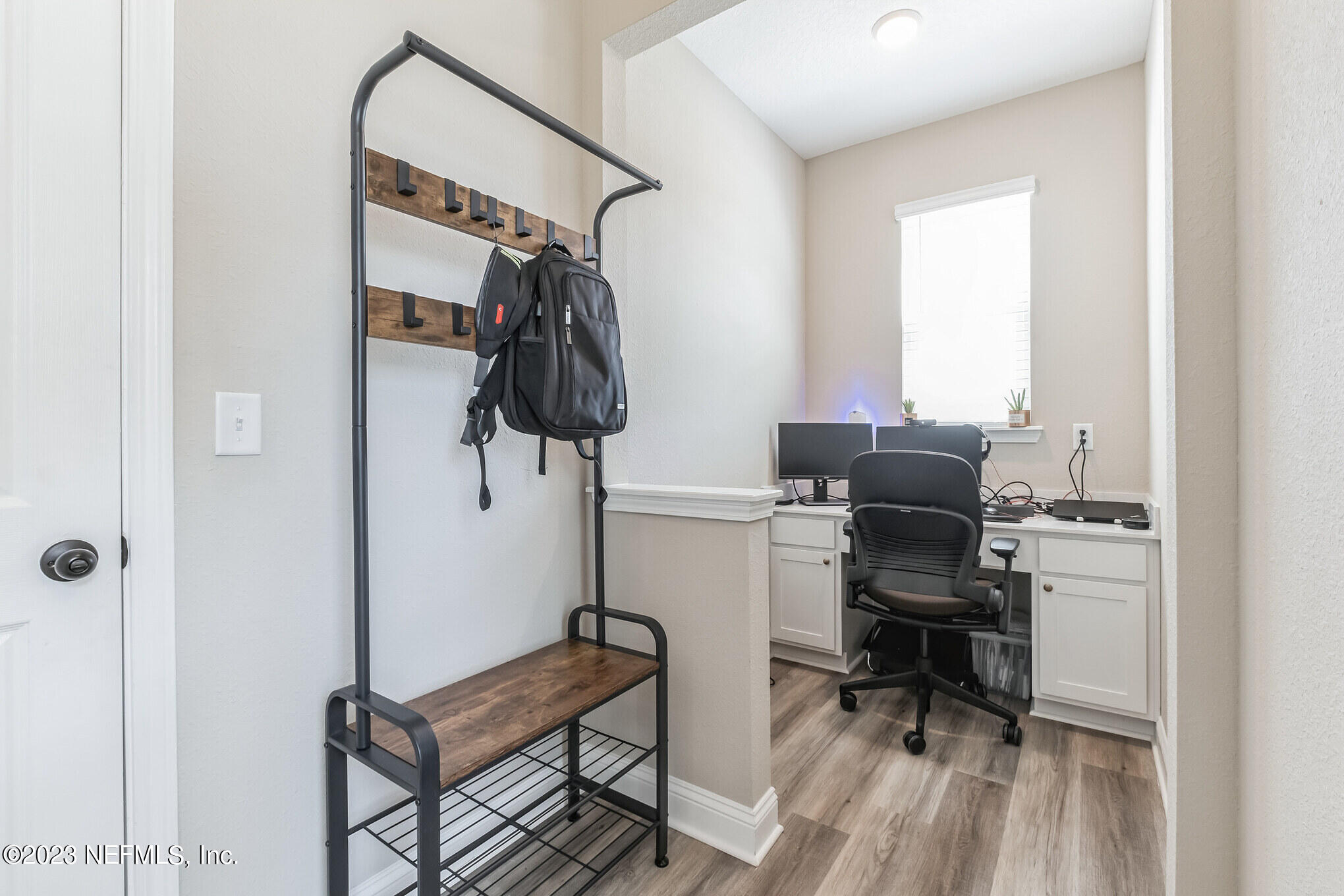 7062 Red Timber Road Jacksonville, FL 32244 - Photo 9 of 31 a view of a workspace with furniture and a window