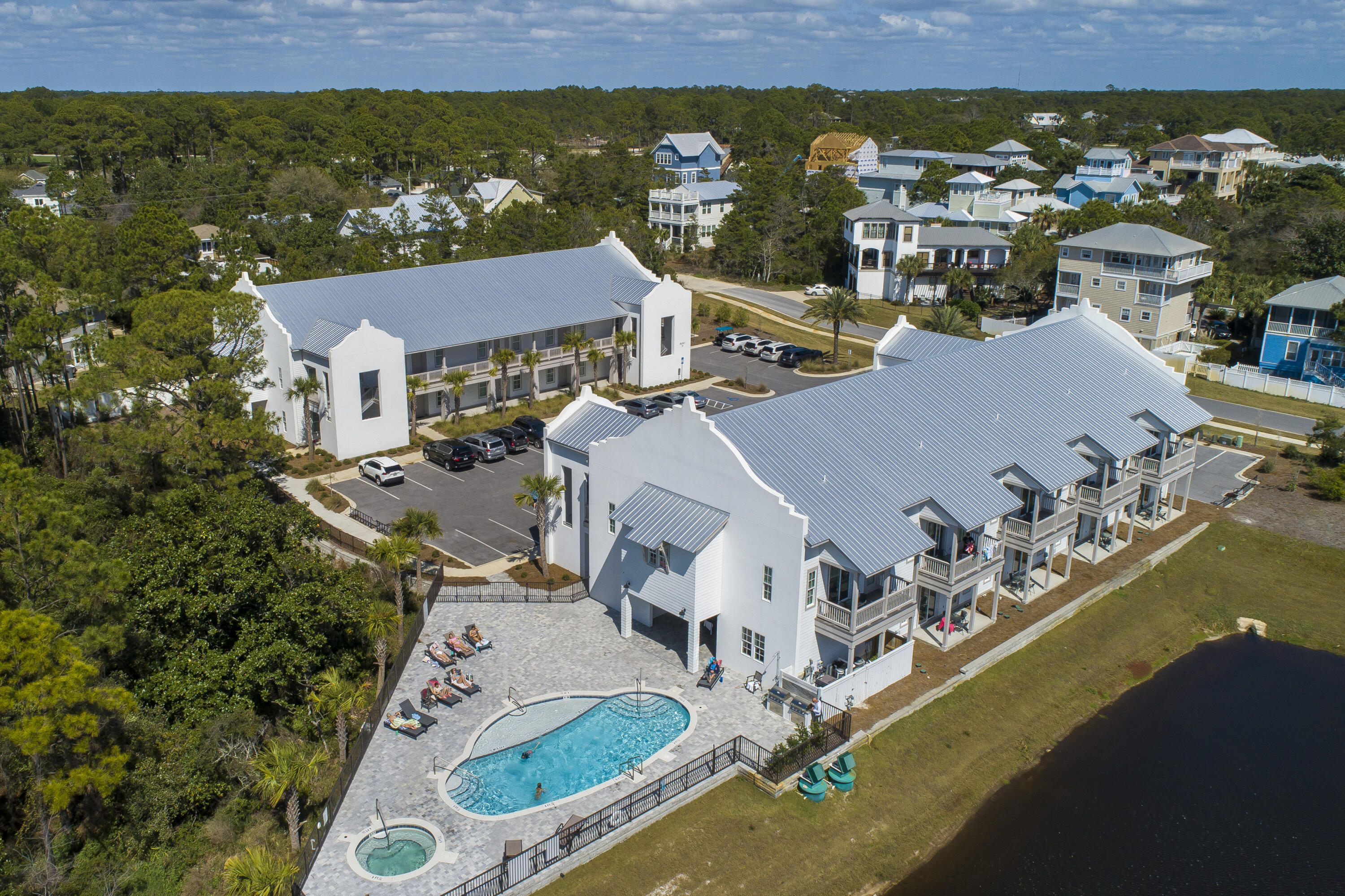 an aerial view of residential houses with outdoor space