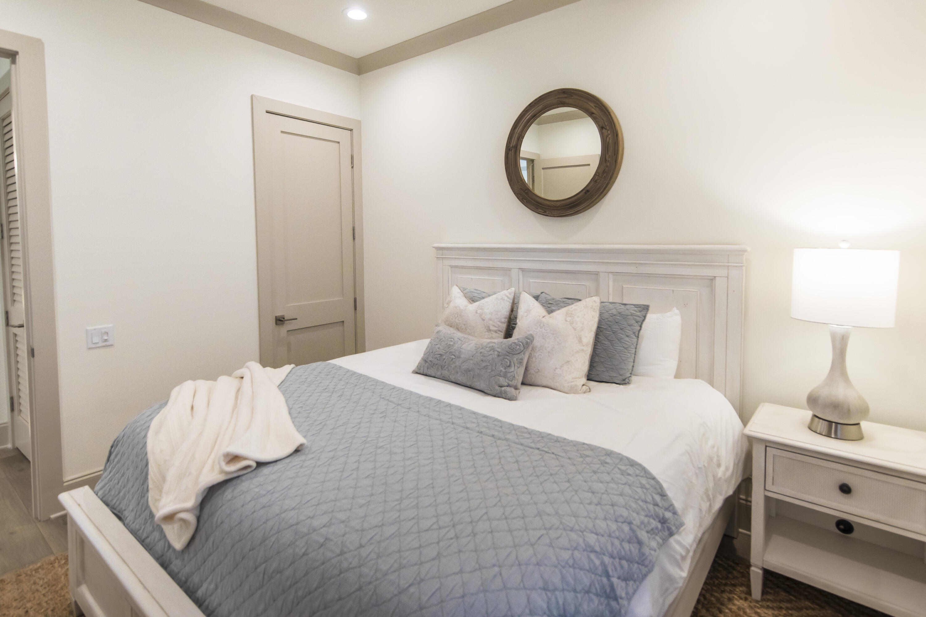 70 Marthas Lane, Unit 1201 Santa Rosa Beach, FL 32459 - Photo 12 of 28 a bedroom with a bed and a lamp