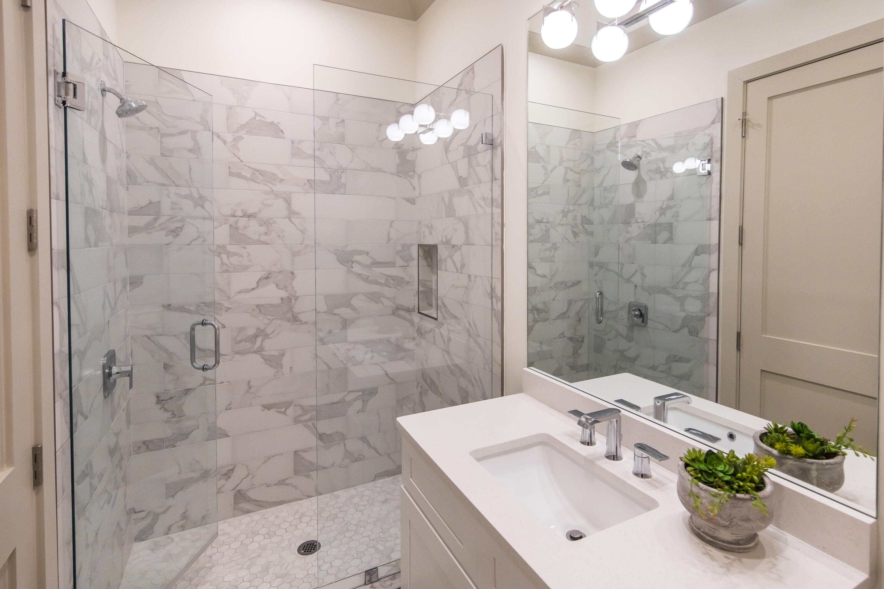 70 Marthas Lane, Unit 1201 Santa Rosa Beach, FL 32459 - Photo 14 of 28 a bathroom with a sink mirror and shower