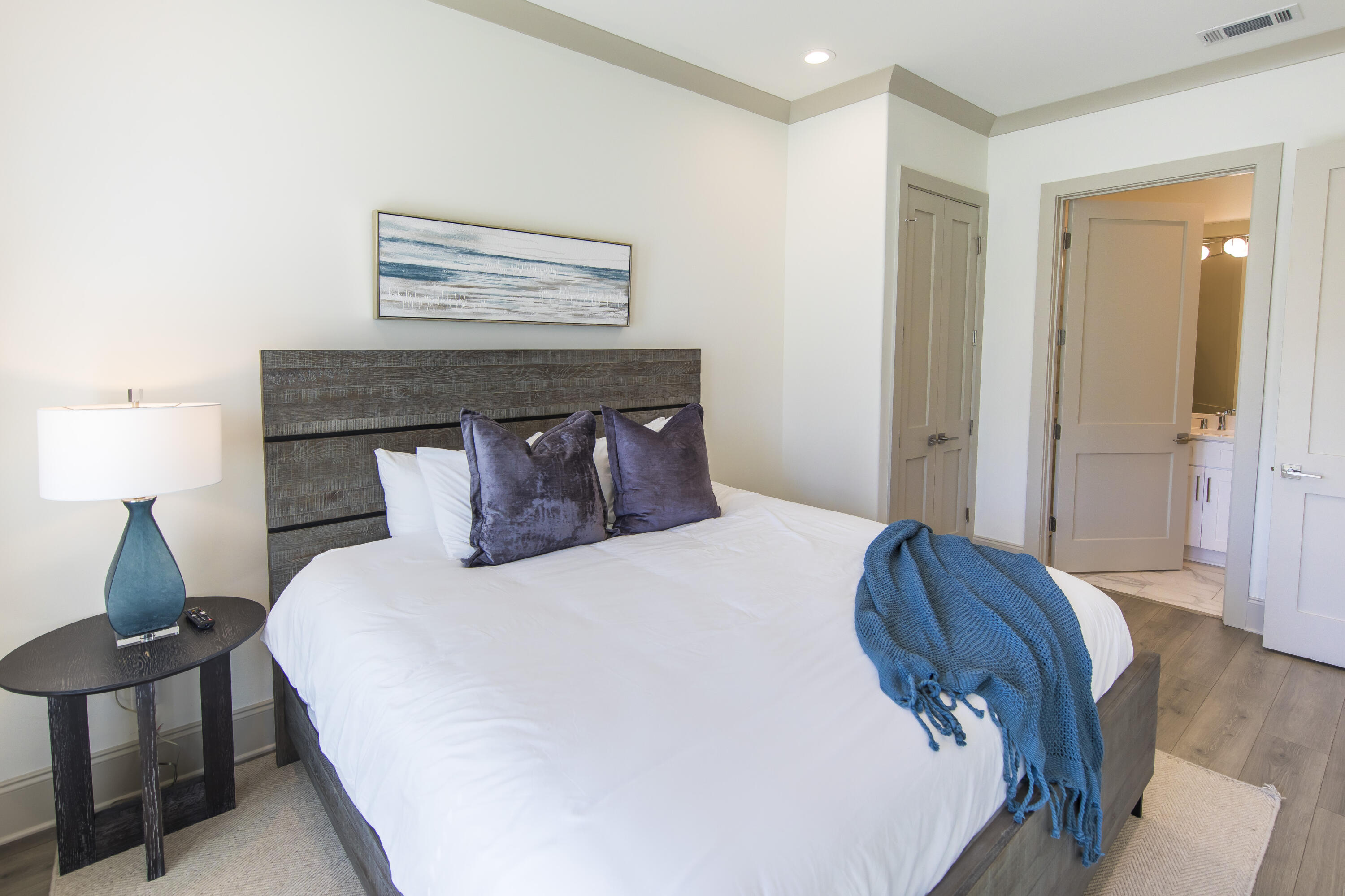 70 Marthas Lane, Unit 1201 Santa Rosa Beach, FL 32459 - Photo 16 of 28 a bedroom with a bed and wooden floor