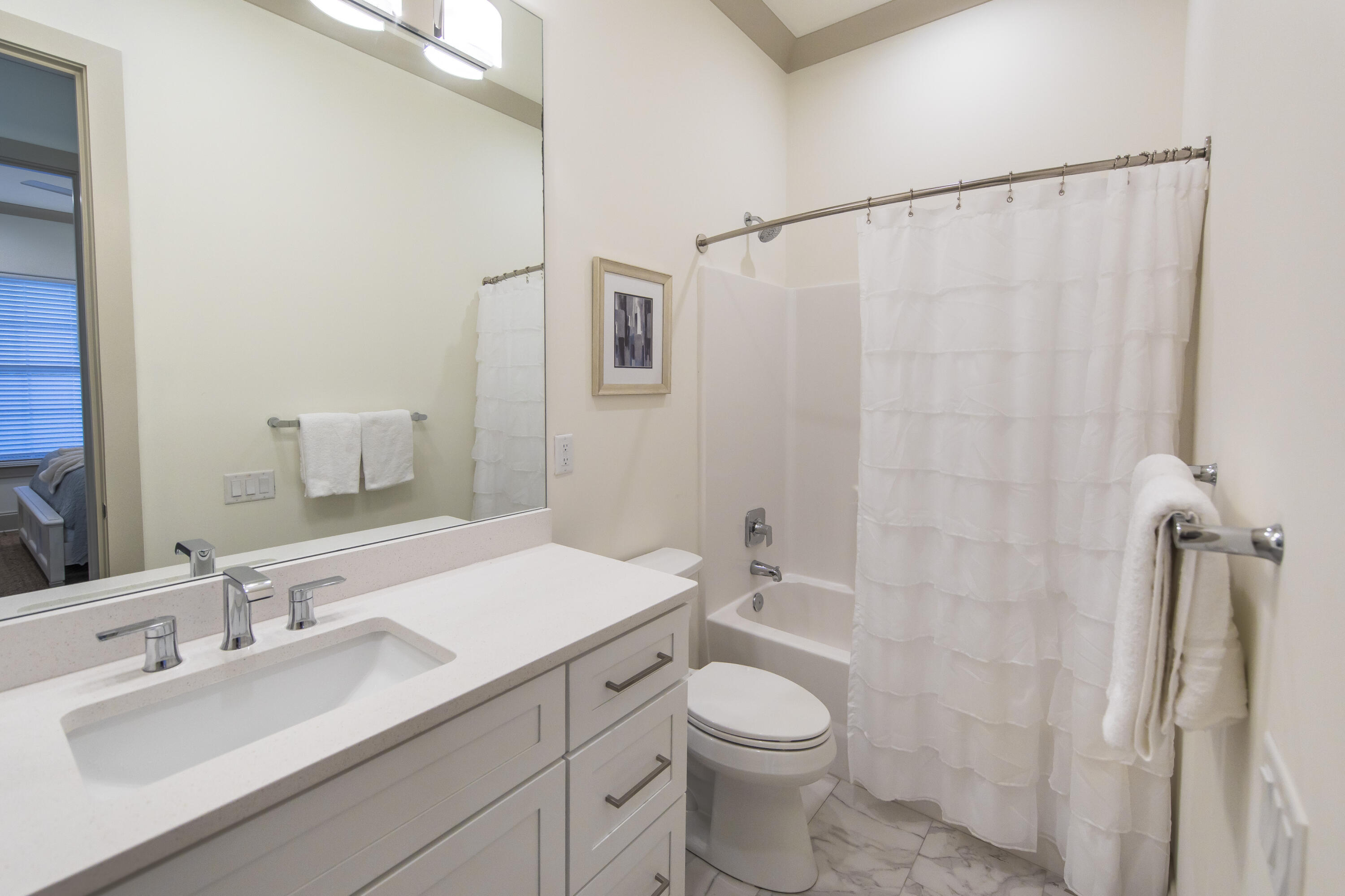 70 Marthas Lane, Unit 1201 Santa Rosa Beach, FL 32459 - Photo 18 of 28 a bathroom with a sink a toilet and shower