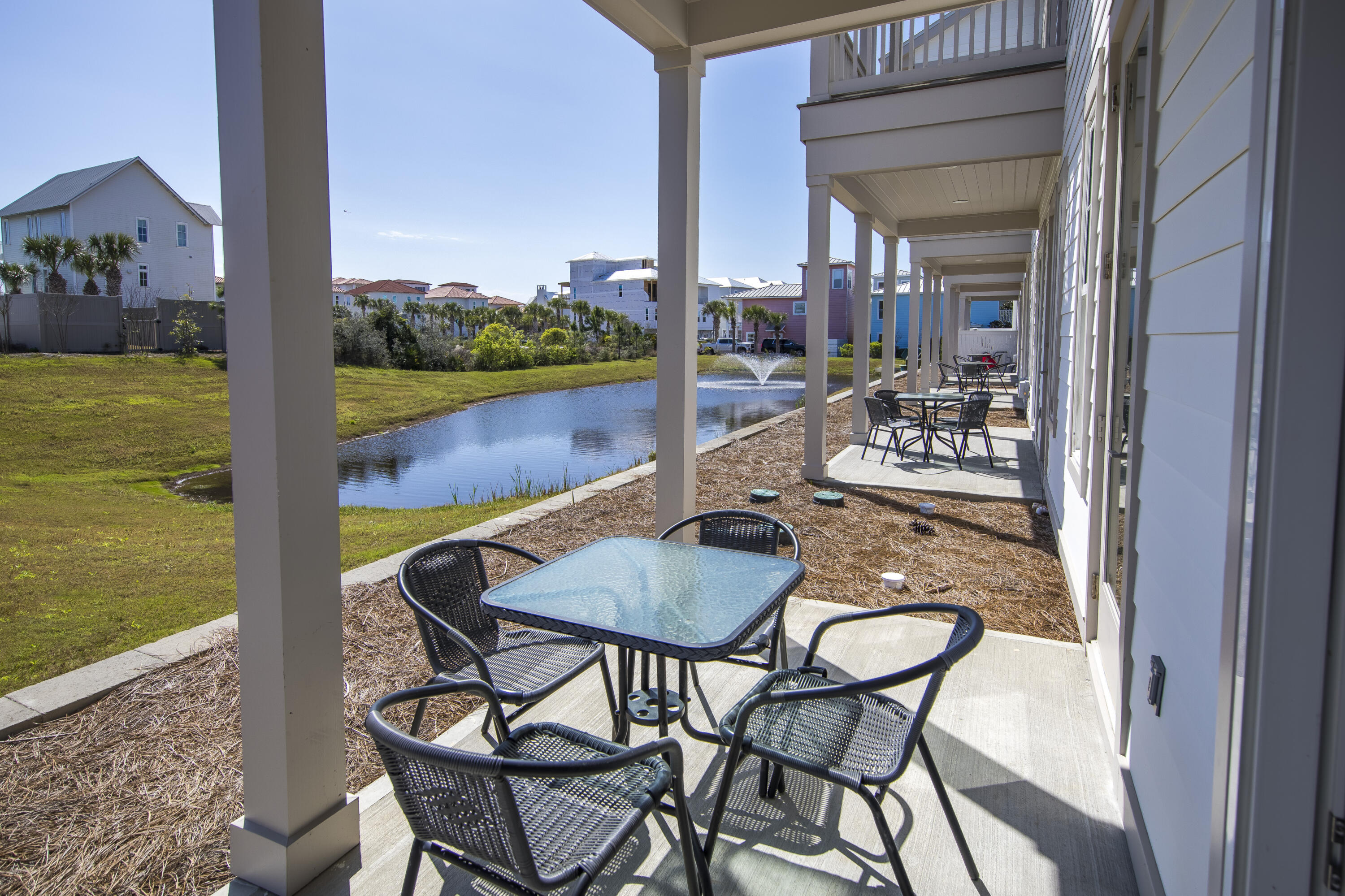 70 Marthas Lane, Unit 1201 Santa Rosa Beach, FL 32459 - Photo 27 of 28 a balcony with table and chairs