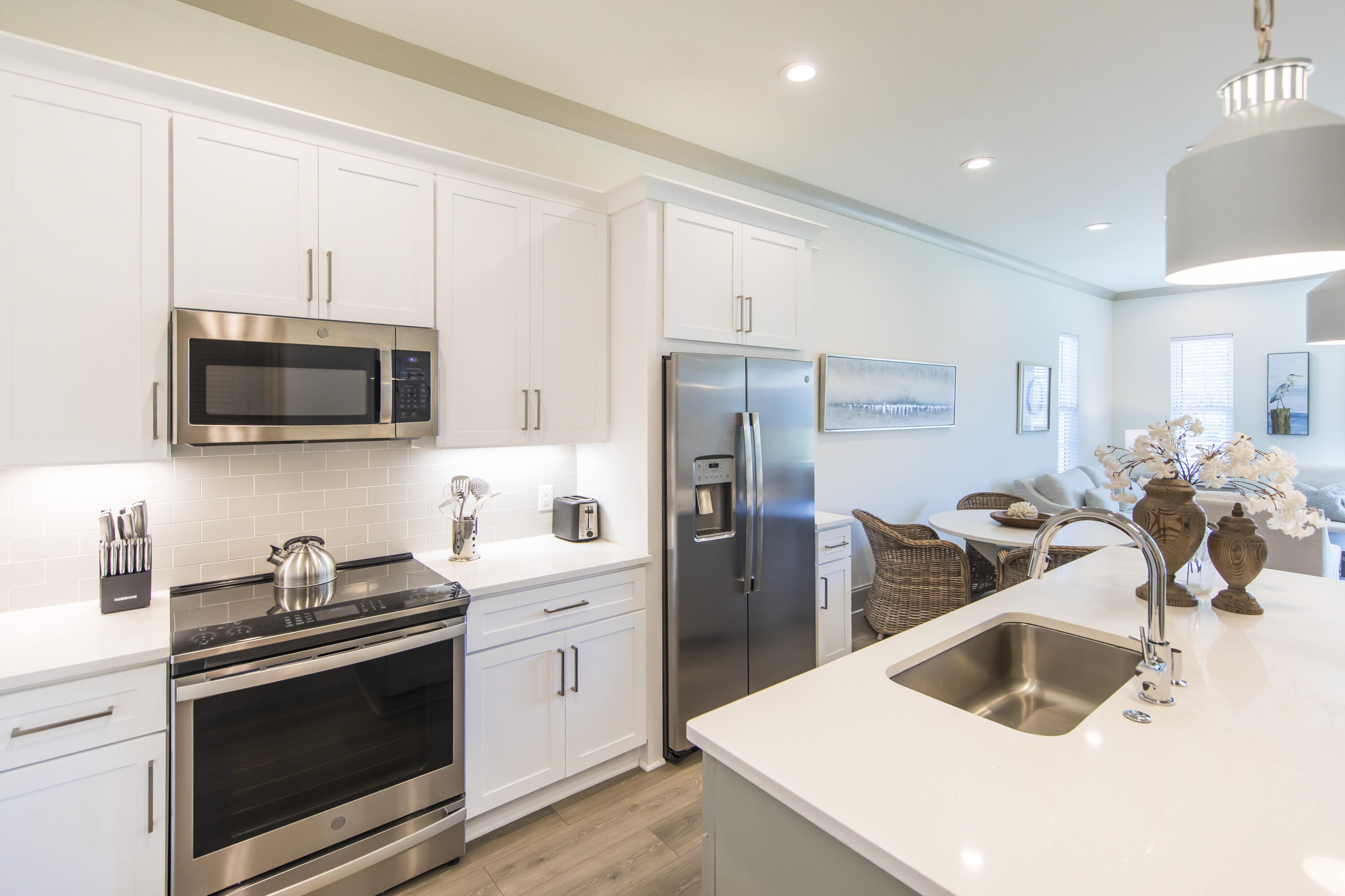 70 Marthas Lane, Unit 1201 Santa Rosa Beach, FL 32459 - Photo 9 of 28 a kitchen that has a sink cabinets and stainless steel appliances