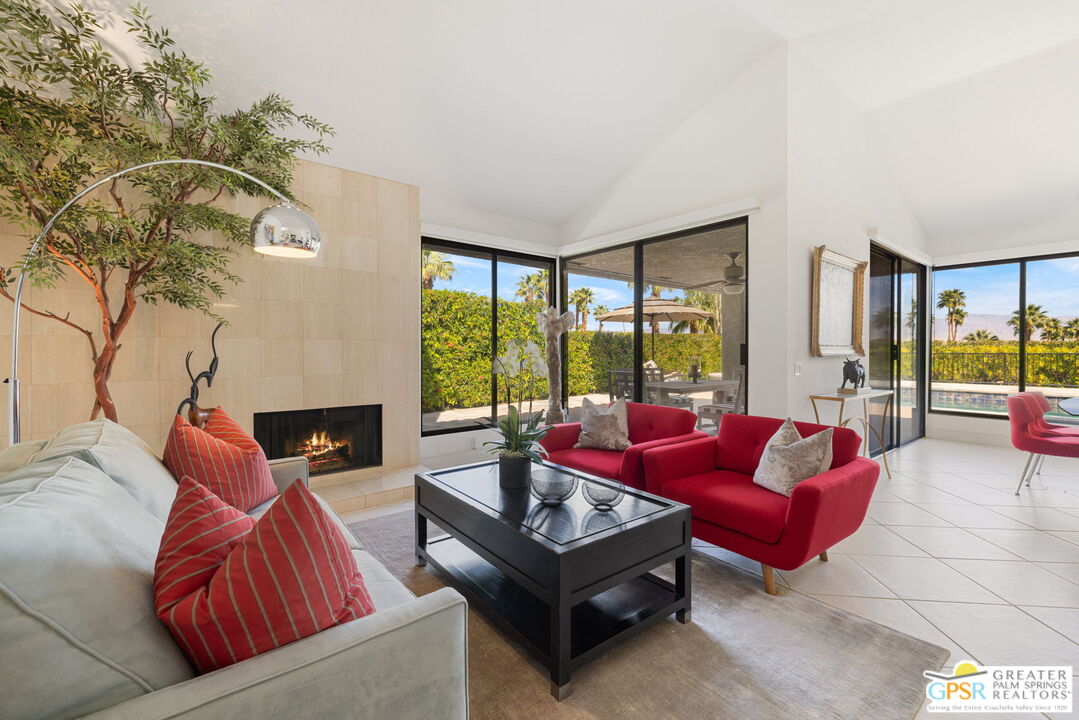8 Alta Vista Rancho Mirage, CA 92270 - Photo 19 of 46 a living room with furniture and a large window