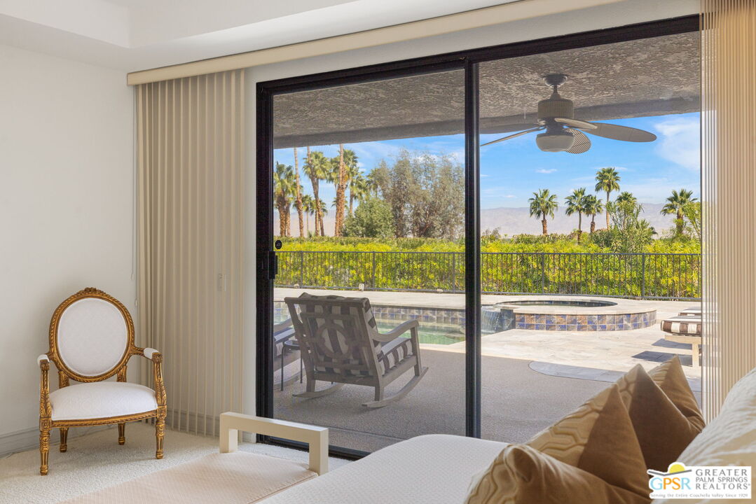 8 Alta Vista Rancho Mirage, CA 92270 - Photo 31 of 46 a living room with couch and a large window