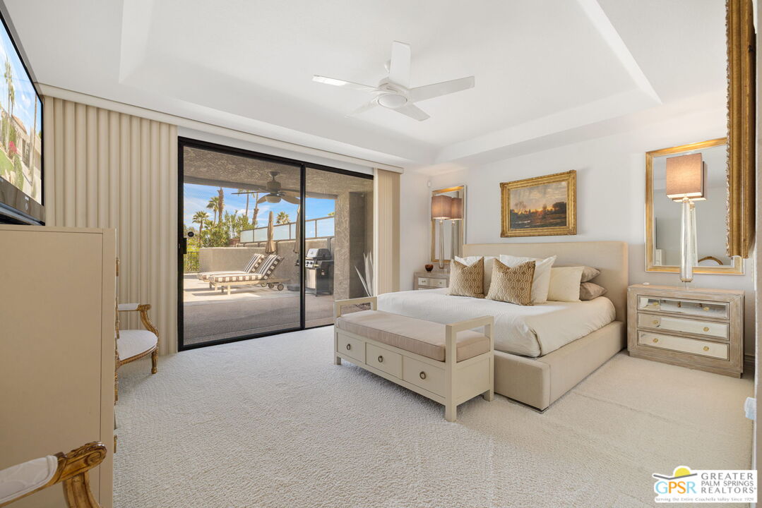 8 Alta Vista Rancho Mirage, CA 92270 - Photo 34 of 46 a spacious bedroom with a bed and a large window