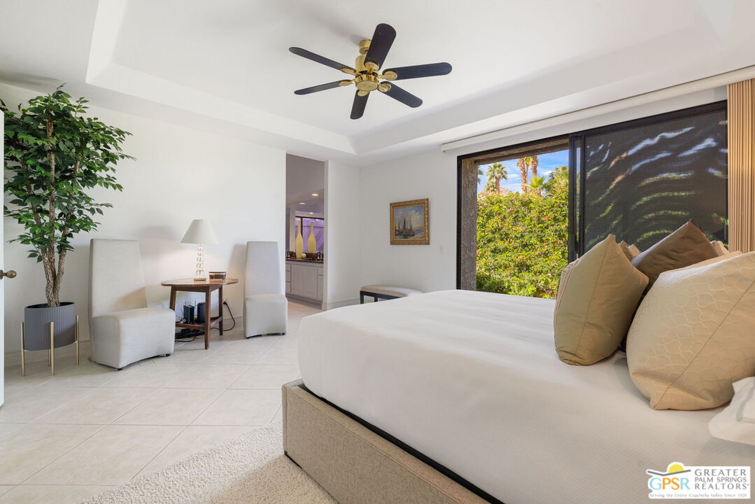 8 Alta Vista Rancho Mirage, CA 92270 - Photo 39 of 46 a bedroom with a bed and a large window