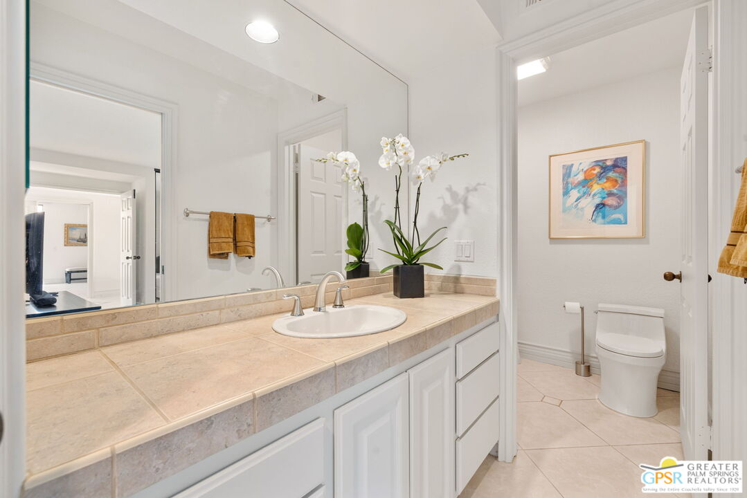 8 Alta Vista Rancho Mirage, CA 92270 - Photo 44 of 46 a bathroom with a sink a toilet and a mirror