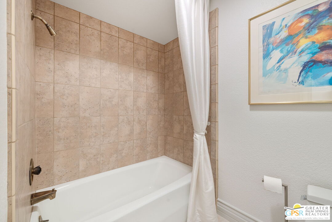 8 Alta Vista Rancho Mirage, CA 92270 - Photo 45 of 46 a bathroom with a bathtub and a shower